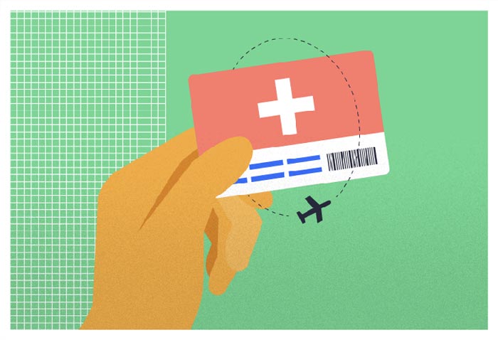 Hand holding a travel insurance card